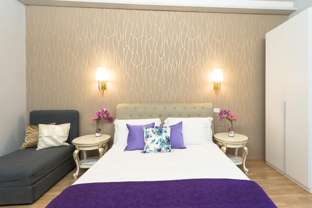 BQ House Milizie Luxury Rooms - Tap to explore photos