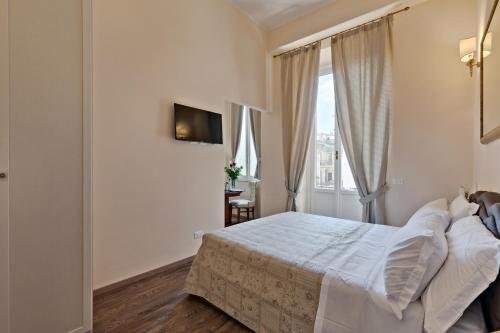 Vatican Domus Luxury Rooms - Tap to explore photos