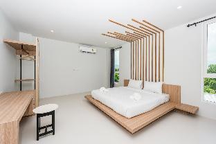 Phuket Marine Poshtel - SHA Plus Room Type - Signature Room with King Bed and Balcony