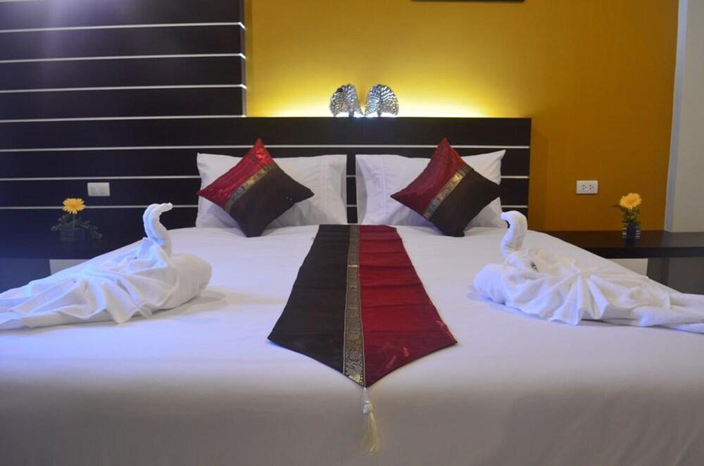 Chalong Boutique Inn - Tap to explore photos