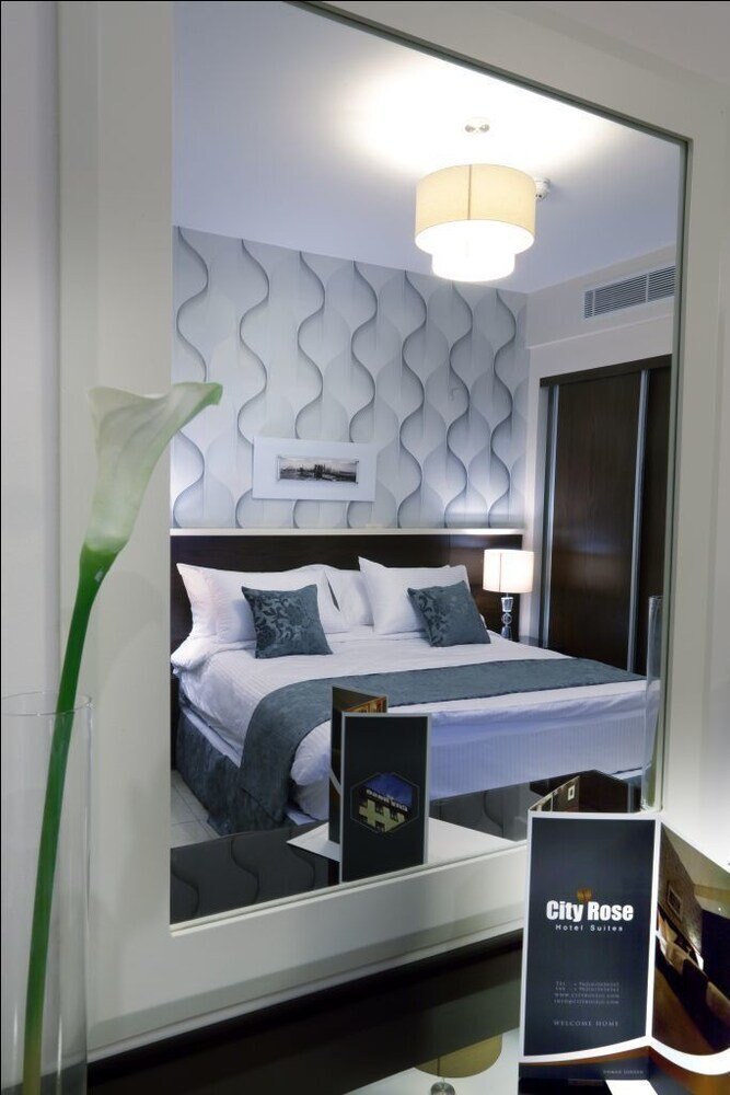 City Rose Hotel Suites - Tap to explore photos
