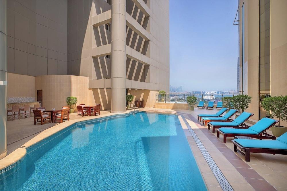 Grand Millennium Dubai - Tap to explore photos