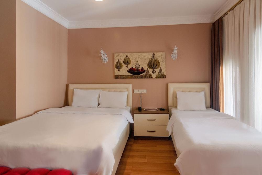 Zendy Suite Hotel - Tap to explore photos