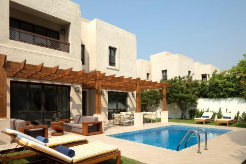 Dubai Creek Club Villas - Tap to explore photos