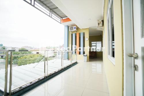 Indah Residence Syariah Mitra RedDoorz - Tap to explore photos