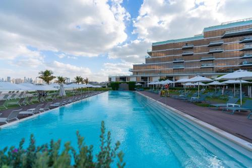 Th8 Palm Dubai Beach Resort Vignette Collection - Tap to explore photos