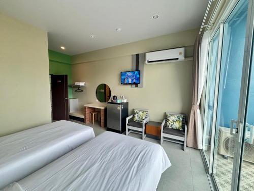 Siri Hotel Phuket - Tap to explore photos