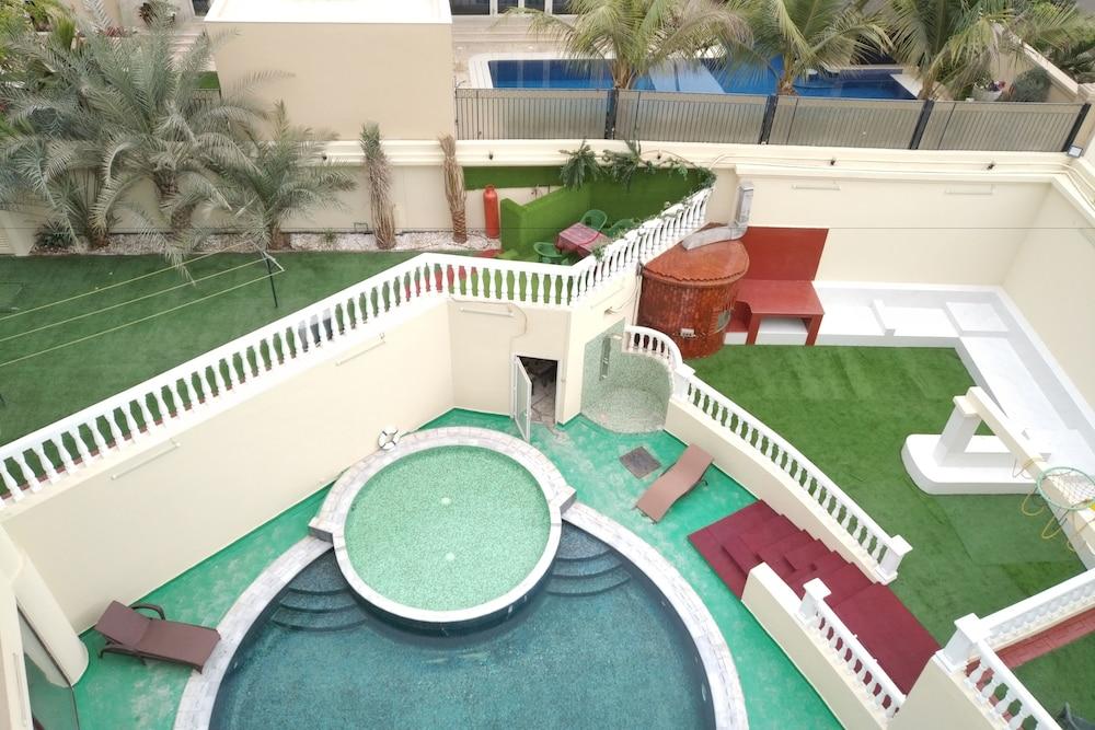 Emirates Hills Lake View Villa - Tap to explore photos