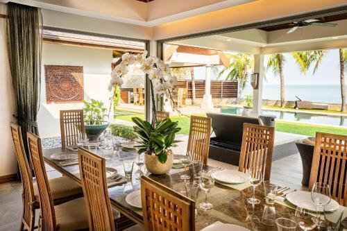 Miskawaan Beachfront Villas - Tap to explore photos
