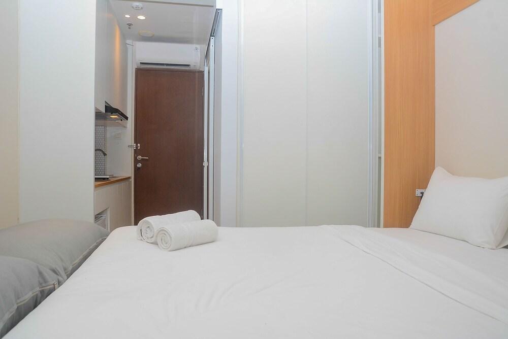 Best Studio Room with Wall Bed Tifolia Apartment - Tap to explore photos
