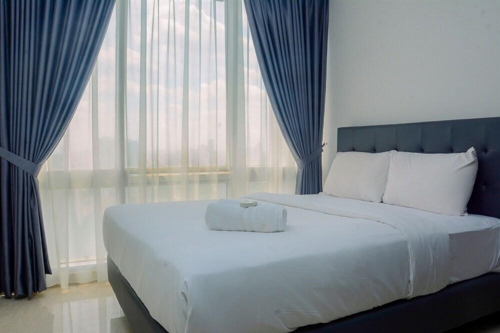 Comfy and Spacious 2BR The Masterpiece Epicentrum Apartment By Travelio - Tap to explore photos