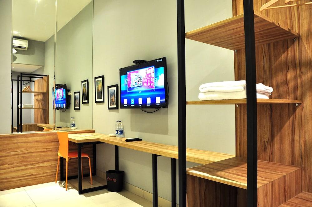 Orange Inn Hotel Mangga Besar - Tap to explore photos