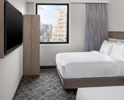 DoubleTree by Hilton New York Times Square South - Tap to explore photos