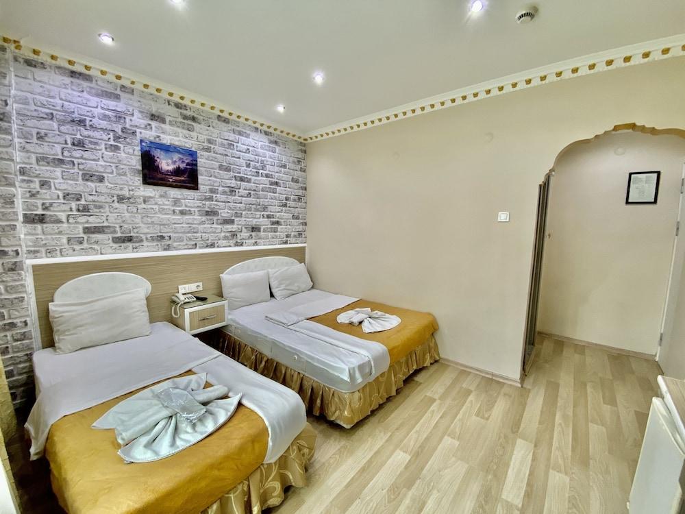 Grand Oral Hotel Room Type - Family Room, Multiple Beds Grand Oral Hotel Room Type - Family Room, Multiple Beds
