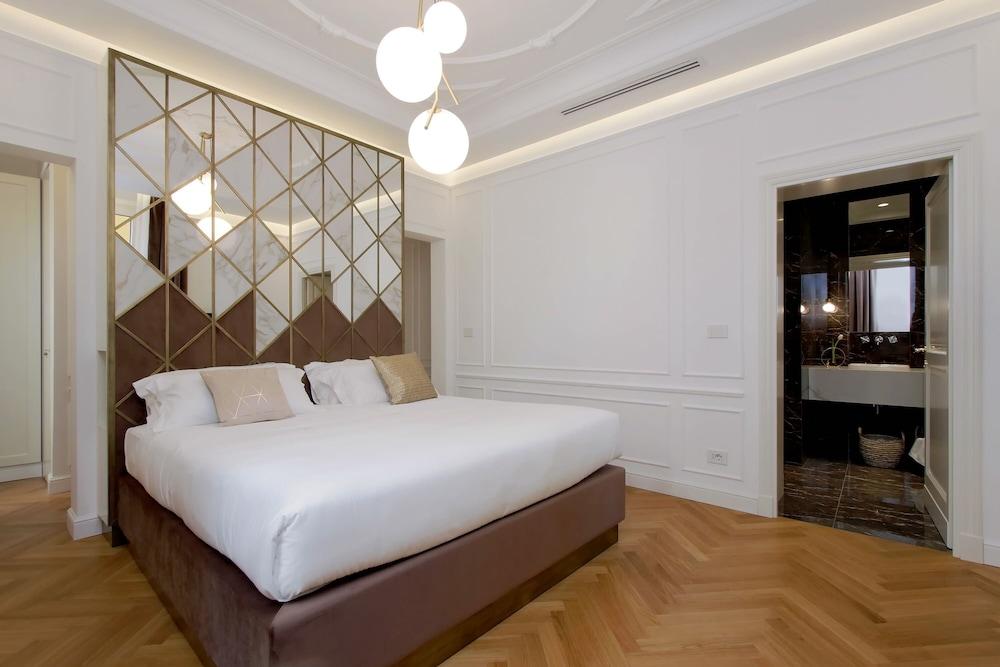 Domna Luxury Suites - Tap to explore photos