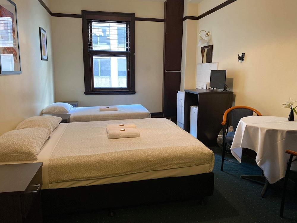 The Occidental Hotel Room Type - Twin Share (1 Queen and 1 Single Bed) with Shared Bathroom