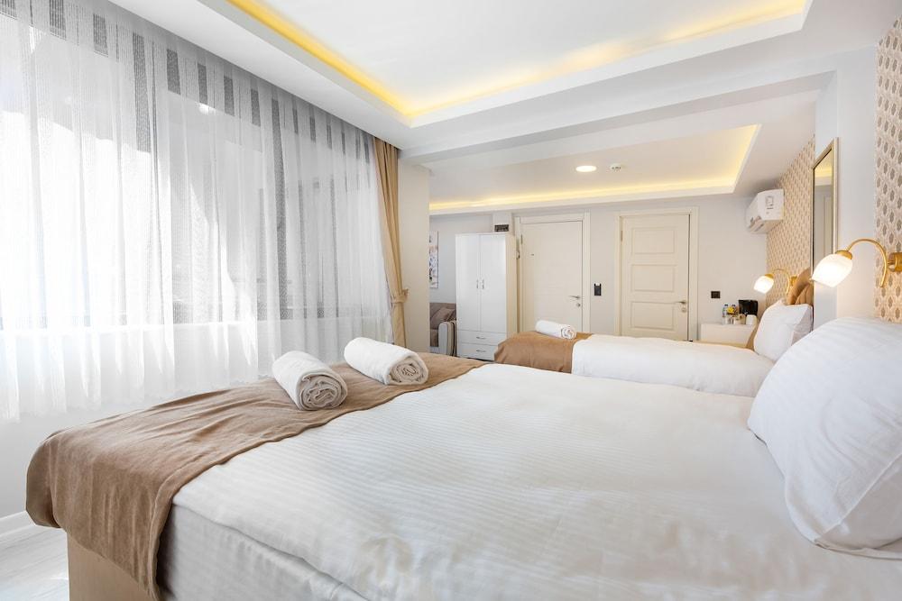 Blue Marmara Suites - Tap to explore photos