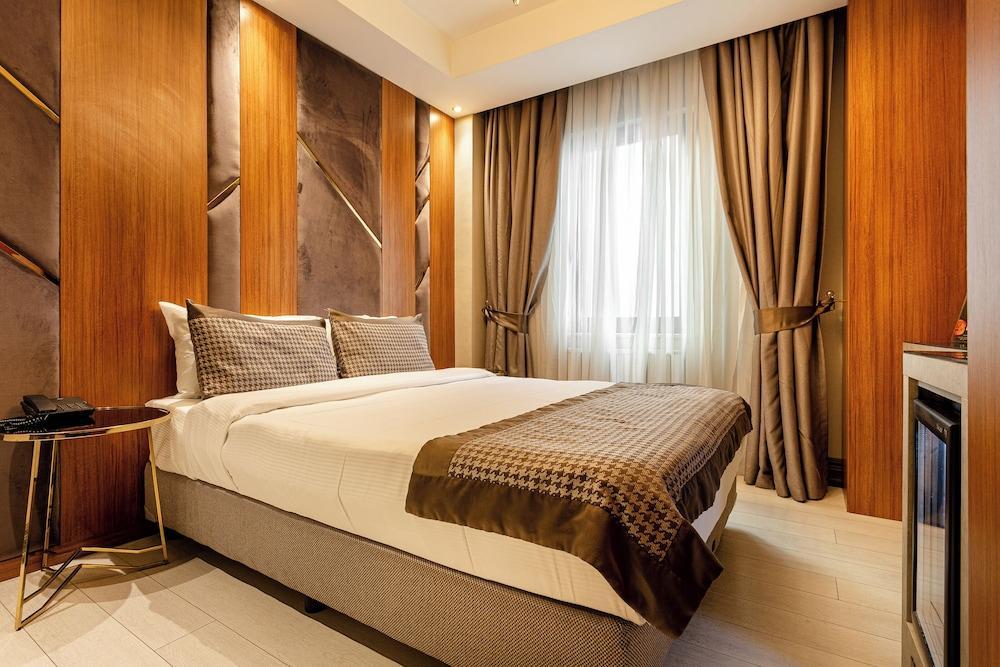 Santra Hotel - Tap to explore photos