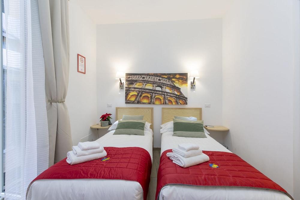 Flatinrome Trastevere Deluxe Rooms - Tap to explore photos