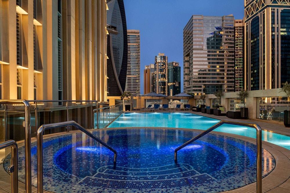 Wyndham Grand Doha West Bay Beach - Tap to explore photos