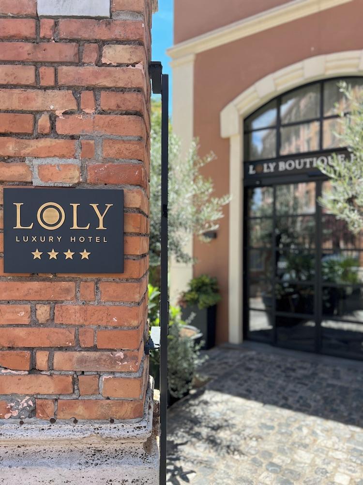 Loly Boutique Hotel - Tap to explore photos