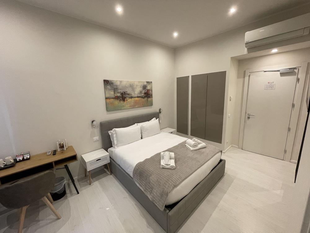 Quintus Luxury Suites - Tap to explore photos