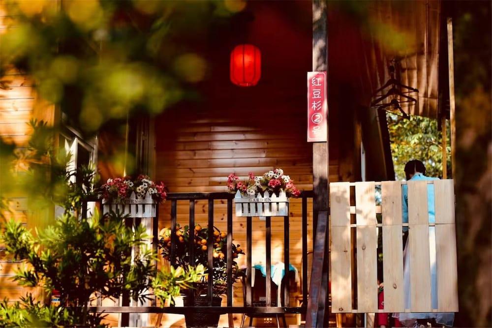 Hongdouchan Wooden House - Tap to explore photos