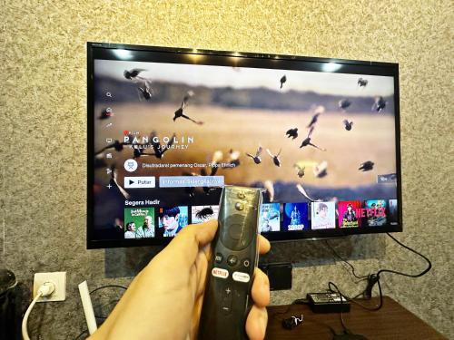 Comfy Studio with Smart Tv Fast Wifi at Baywalk Mall Tower C Room Type - One-Bedroom Apartment