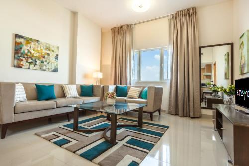 Staycae Holiday Homes - Suburbia, Jebel Ali - Tap to explore photos