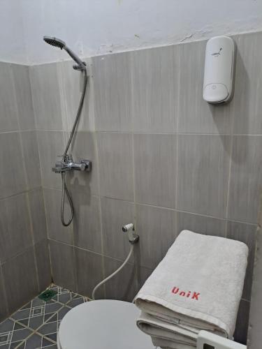 UNIK Guest House Syariah - Tap to explore photos