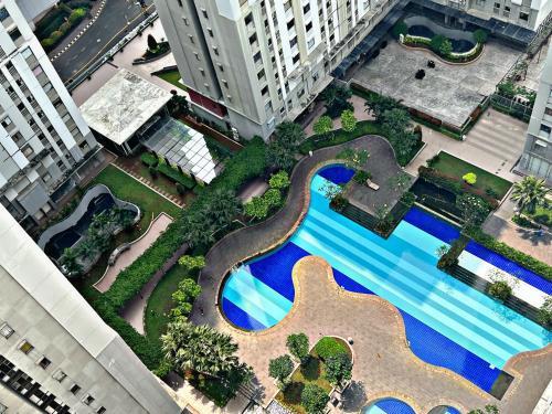 Minimalist & Comfy Studio Pool View at Baywalk Mall Pluit Tower C - Tap to explore photos
