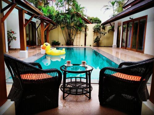 Orange palm pool villa - Tap to explore photos