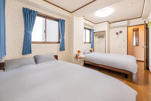 台東区寝室4つと広々吹き抜けリビングのメゾネットタイプのお家