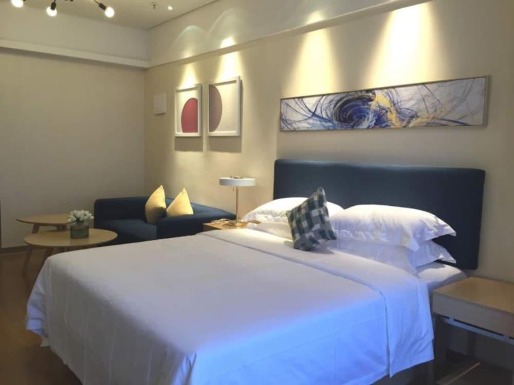 Poltton International Service Apartment Hesheng Palza Branch - Tap to explore photos
