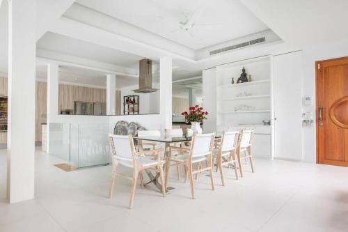 Villa Nirvana - Beachfront Tropical Chic 4BR Haven in Cape Panwa, Phuket - Tap to explore photos