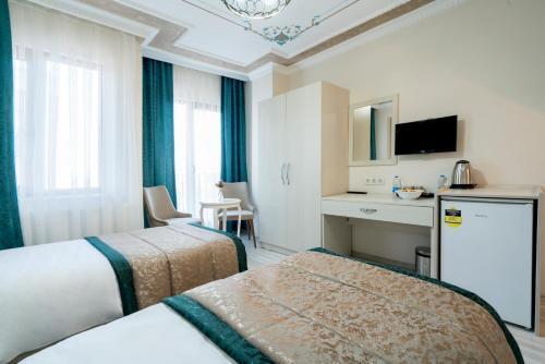 ATAM HOTEL - Tap to explore photos