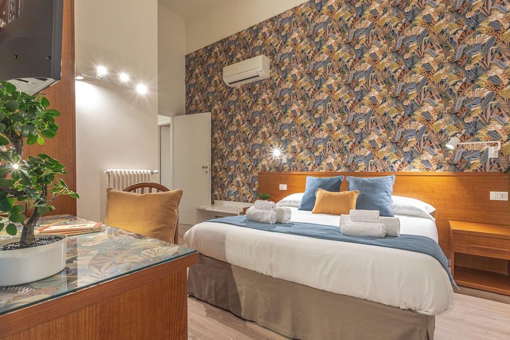 Vittoria Garden Suites Elegant Guesthouse Near Colosseum - Tap to explore photos