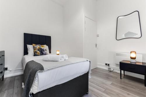 Stylish and Convenient 2BD Flat w/ Outdoor Space - Tap to explore photos