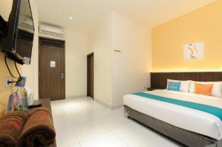 Sans Hotel Max Living Cengkareng - Tap to explore photos
