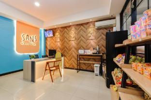 Sans Hotel Max Living Cengkareng - Tap to explore photos