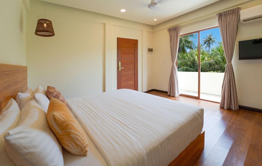 Niru Isle Maldives Room Type - Deluxe Double or Twin Room, Garden View Niru Isle Maldives Room Type - Deluxe Double or Twin Room, Garden View