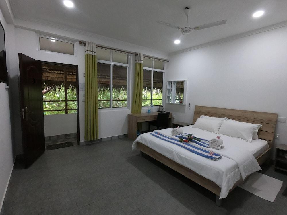 Dhangethi Inn - Tap to explore photos
