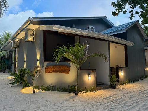 Dhigurah Beach Inn - Tap to explore photos