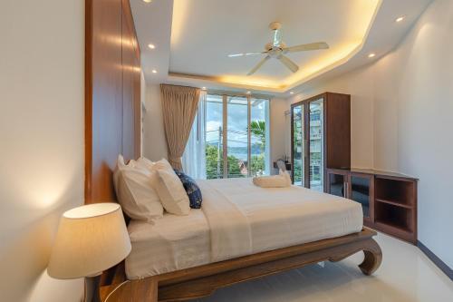 White Villa Patong - Tap to explore photos