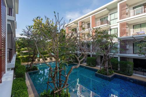 The Title Rawai West Wing Pool View Suite - Tap to explore photos