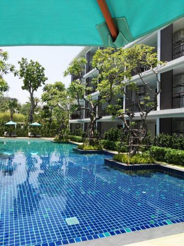 The Title Rawai West Wing Pool View Suite - Tap to explore photos