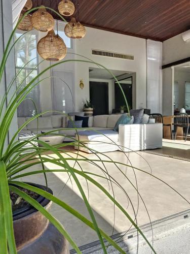 Discover a Tropical Hideaway within walking distance to Bang Tao Beach - Tap to explore photos
