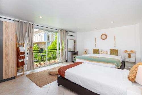 Kata Station Boutique Hotel, Kata Beach - Tap to explore photos