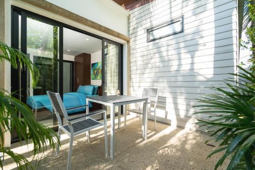 The Thara Villa Surin Beach - Tap to explore photos