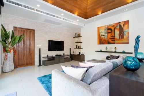 The Thara Villa Surin Beach - Tap to explore photos